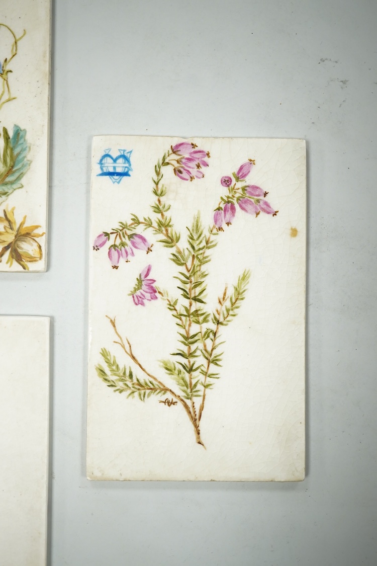 Set of seven late 19th century miniature floral painted pottery plaques, each monogramed 8.5cm high, possibly for place settings